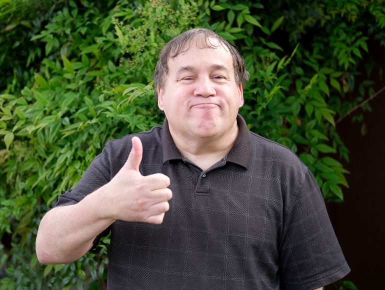 person giving a thumbs-up sign