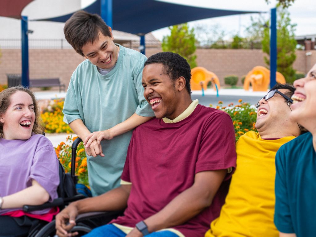 stock photo of a group of young adults socializing in an outdoor setting