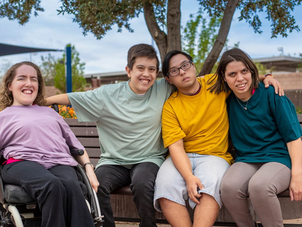 group of friends sitting in a park